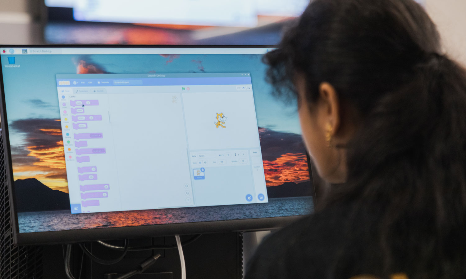 Student working on coding on a computer